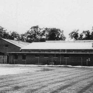 Multistory building with covered walkway on grass