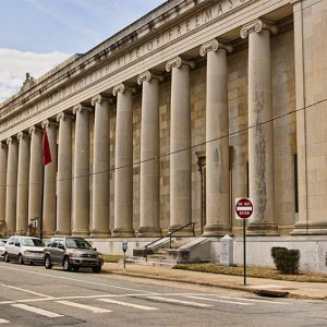 Multistory building with row of columns on street