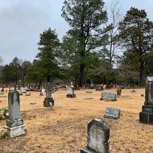 Weathered monuments and gravestones in cemetery