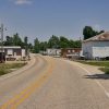 Garage buildings and brick building on two-lane road