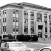 Multiple-story courthouse building as seen from streetcorner