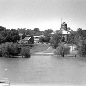 River with town and brick courthouse in the background