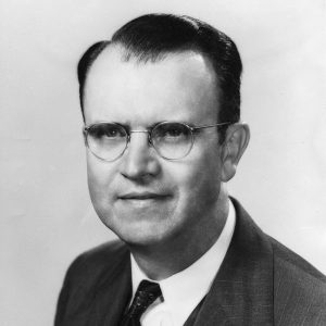 White man in wearing glasses in suit and tie