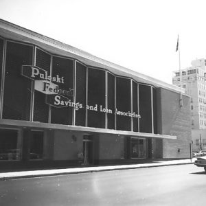 Multistory "Pulaski Federal Savings and Loan Association" building with multistory building in the background