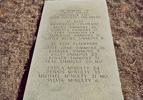 "In memory of those killed December 1987 Pope County Arkansas" flat engraved marker on grass