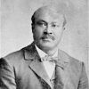 Bald African-American man in suit and bow tie