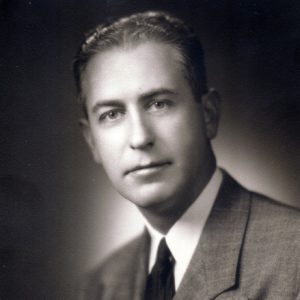 White man in suit and tie