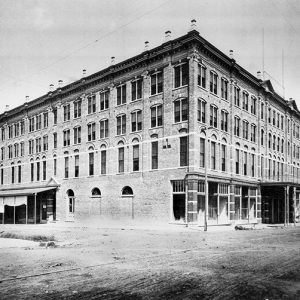 Four-story brick building on street corner