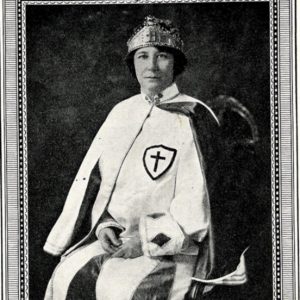 White woman with crown sitting in her robes in frame labeled "Robbie Gill Comer Imperial Commander"