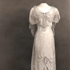 White lace dress on headless display mannequin