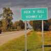 "Rock N Roll Highway 67" sign with street and red truck