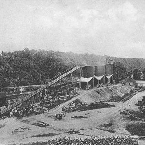 Smokestacks with wooden outbuildings at mining site