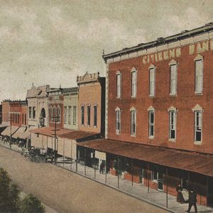 Multistory Citizens Bank building and storefronts on street