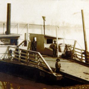 "Sod of Memphis" ferry boat waiting for passengers with two men and a child standing on the deck