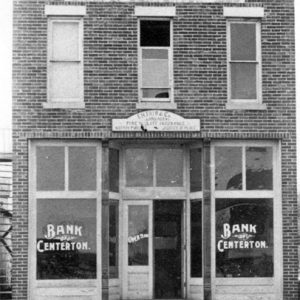 Two-story bank building with "Bank of Centerton" on the windows