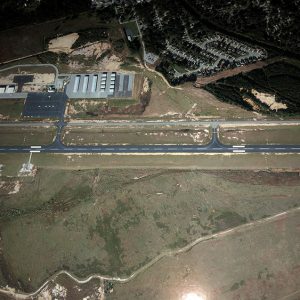 View of airport runway and buildings from above