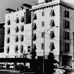 Multistory building and parking lot on city street