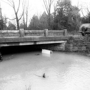 Concrete bridge over flooded creek