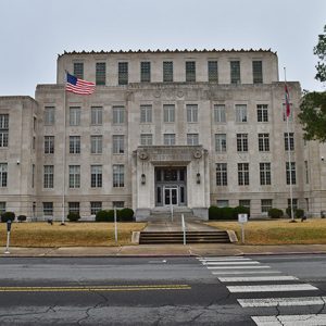 Multistory building with flag on street