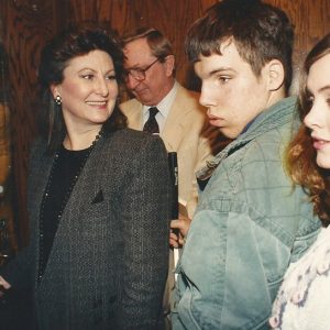 White woman and man in elevvator with white girl and boy