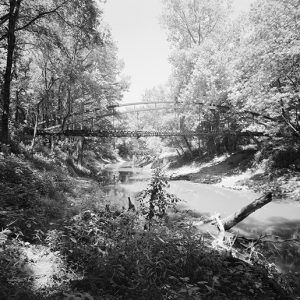 Steel arch bridge over large creek