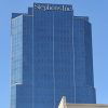 glass and steel skyscraper with "Stephens Inc." at the top