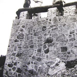 Overlook stone wall with wooden railing