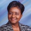 African-American woman smiling in dress