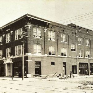 Multistory building on street with power lines