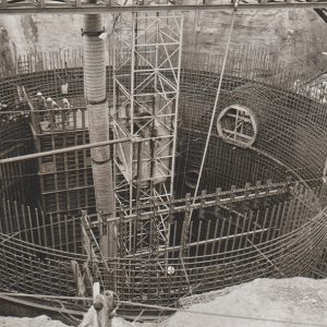 White workers inside multistory underground missile silo under construction