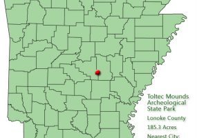 Arkansas map with red dot in Lonoke County and explanation in green text