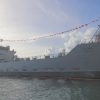 Naval ship with flags on mast line