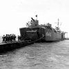 Soldiers waiting on floating dock to board naval vessel number 845