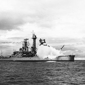 Navy warship firing a missile into the air from its bow