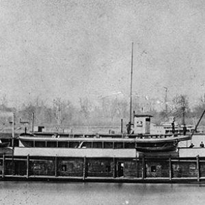 Side view of naval steamboat on river