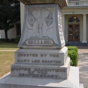 Crossed flags and raised engraving on pedestal base