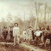 White men and child posing with logging horses