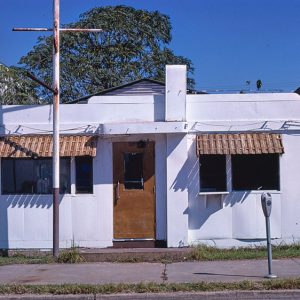 Single-story building and sidewalk on street