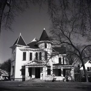 Multistory house with towers and arched windows