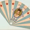 White woman on a blue and white fan with red stars "I"m a Fan Virginia Johnson"