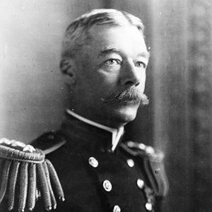 White man with mustache in military uniform with epaulets