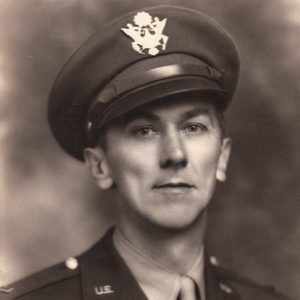 White man in military uniform with cap