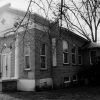 Brick church building with arched doorway