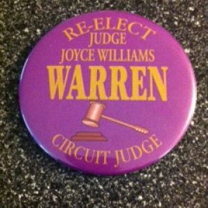 Purple campaign button with yellow text