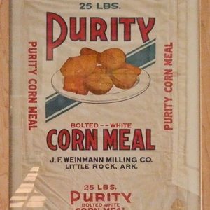 "Purity Corn Meal" flour sack in wooden frame