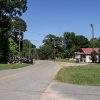 Single story buildings on two-lane road with power lines