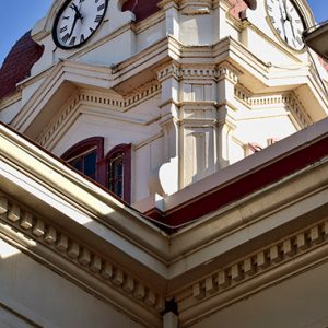 Close-up of clock tower with arched windows