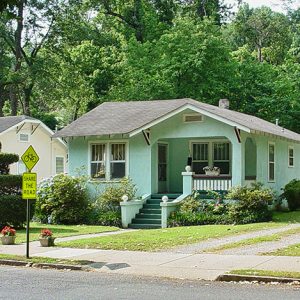 Single-story houses with covered porches on street