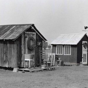 Small wooden shed like buildings with metal roofs