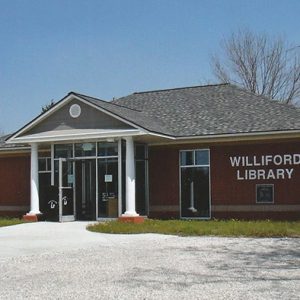 Single-story brick building with parking lot